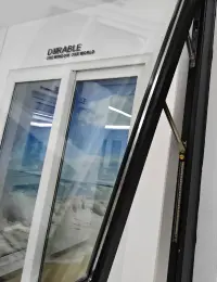 Top-hinged unit with support arm and glass panel