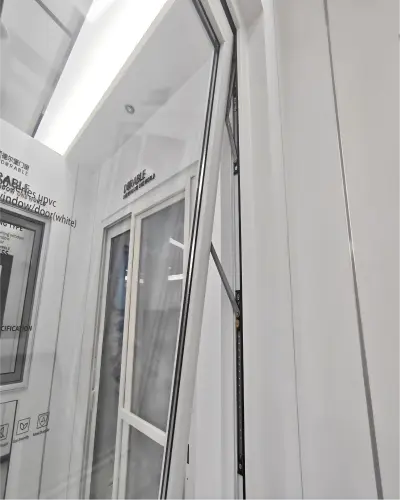 Top-hinged unit with support arm and glass panel