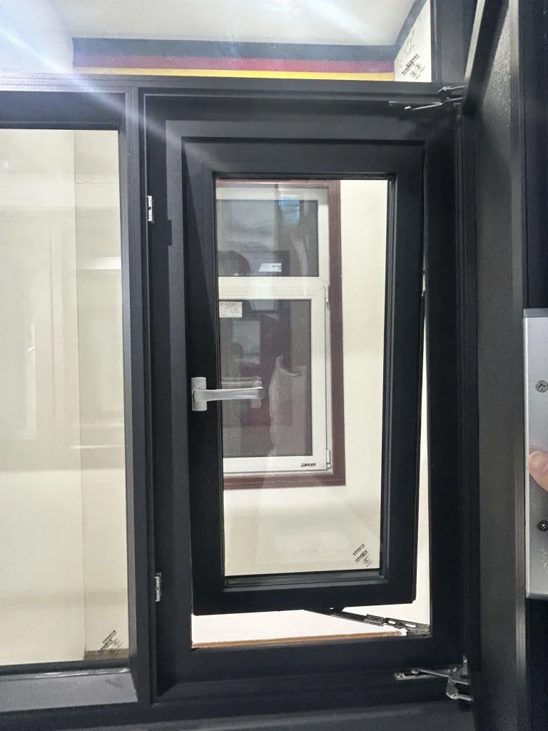 Youju 100 thermal-break aluminum tilt-and-turn window showroom sample with an inward-open sash